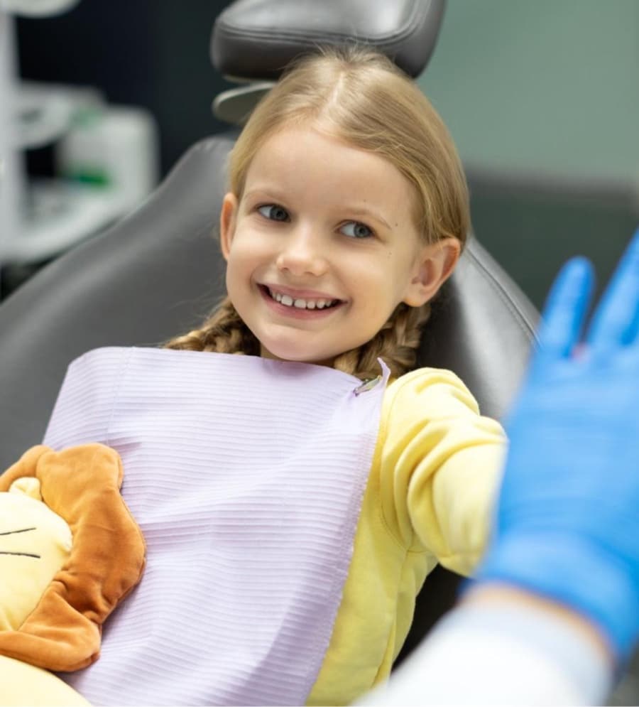 young girl smiling during appointment